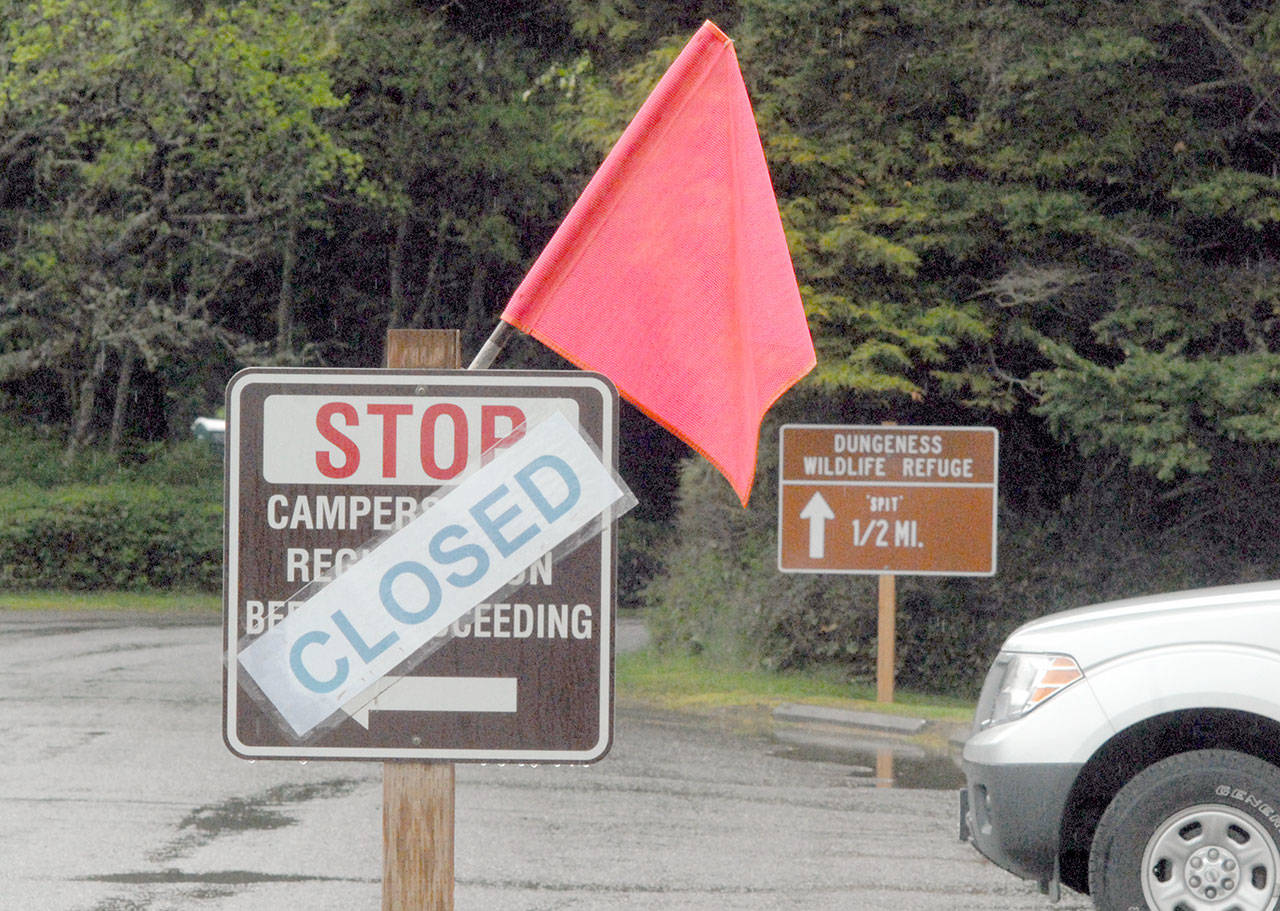 A sign indicates the campground closure at Dungeness County Park northwest of Sequim on Saturday, May 2, 2020. (Keith Thorpe/Peninsula Daily News)