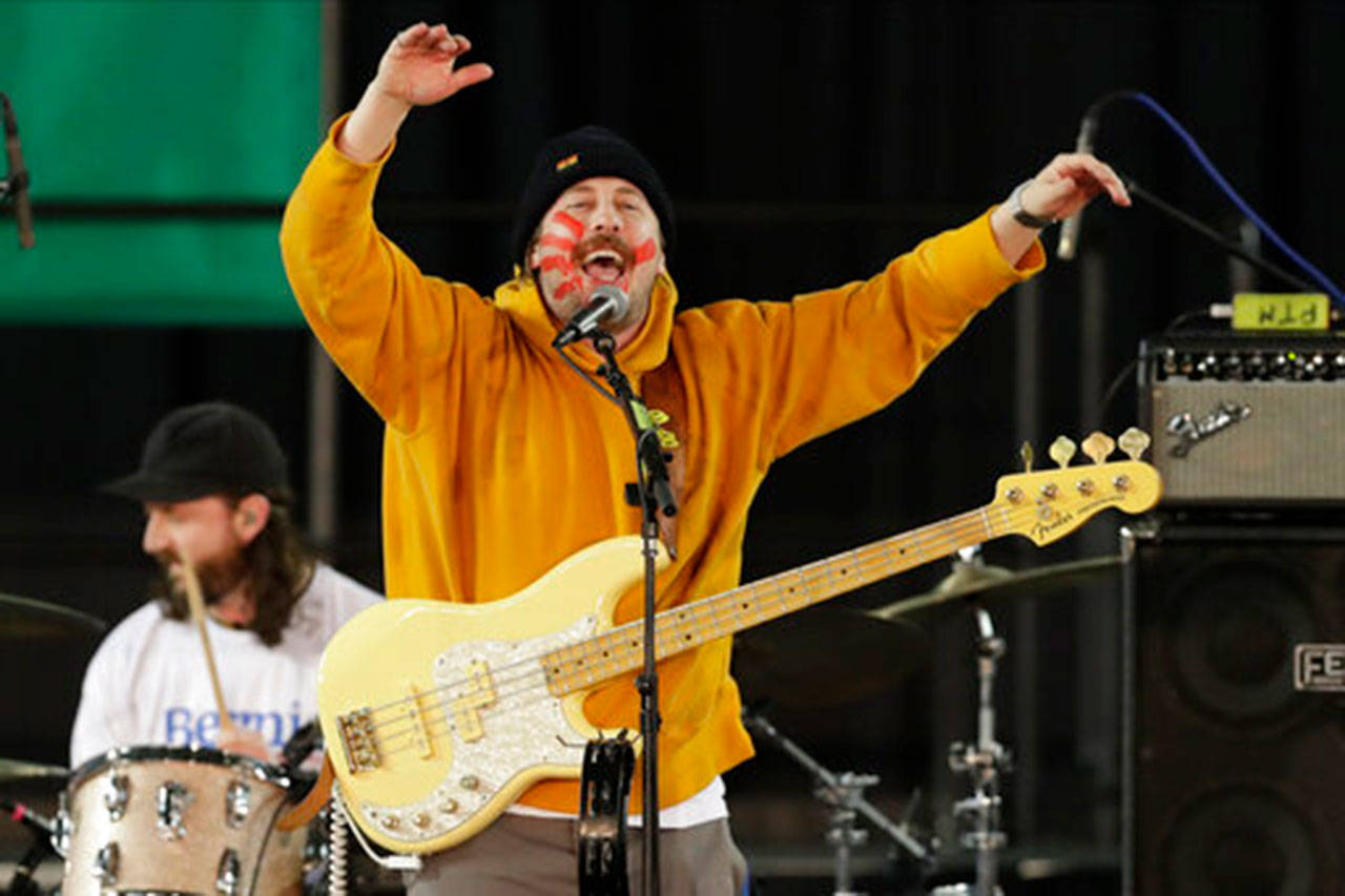 In this Feb. 17, 2020, file photo, Zachary Scott Carothers performs with his rock band “Portugal. The Man” during a campaign event for Democratic presidential candidate Sen. Bernie Sanders in Tacoma, Wash. After the school board at the Matanuska-Susitna Borough School District in Palmer voted 5-2 to remove five classics including F. Scott Fitzgerald’s “The Great Gatsby,” “Joseph Heller’s Catch-22” and Maya Angelou’s “I Know Why the Caged Bird Sings,” the band announced it would buy the books for any student or parent who wanted them. (Ted S. Warren/Associated Press file)