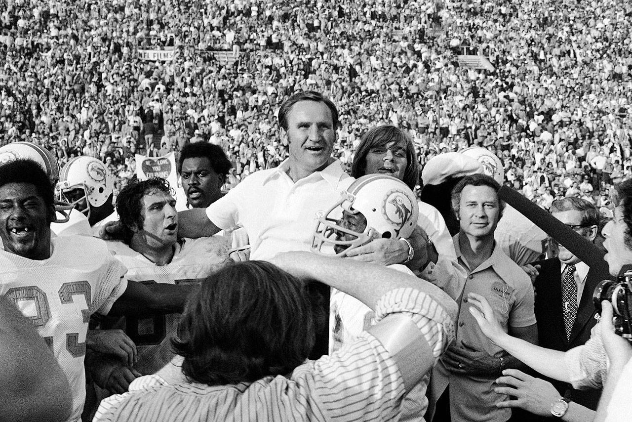 In this Jan. 14, 1973, file photo, Miami Dolphins coach Don Shula is carried off the field after his team won the NFL football Super Bowl game 14-7 against the Washington Redskins in Los Angeles. Shula, who won the most games of any NFL coach and led the Miami Dolphins to the only perfect season in league history, died Monday, May 4, 2020, at his home in Indian Creek, Fla., the team said. He was 90. (AP Photo/File)