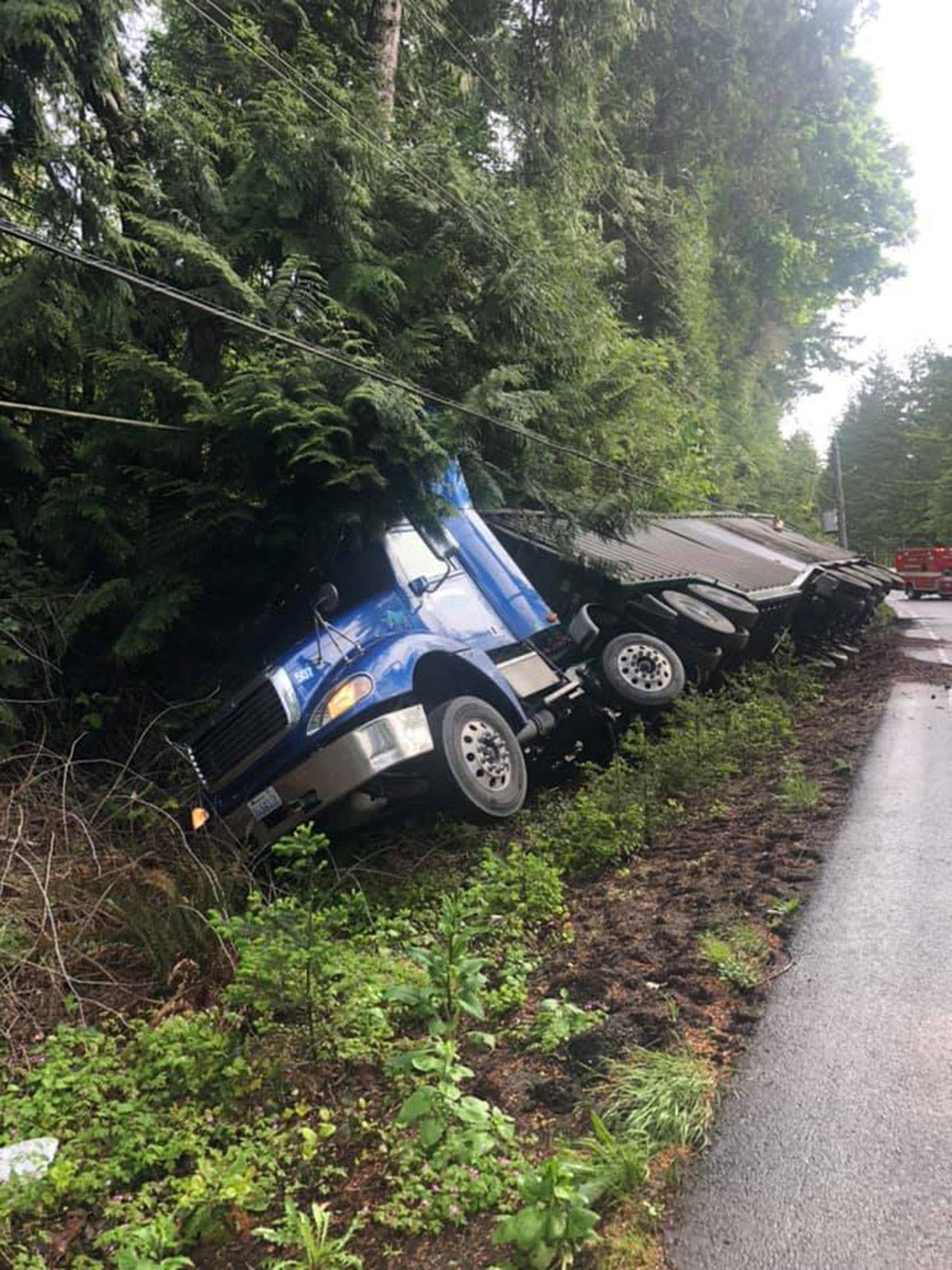 Crews are responding to a semi-truck that rolled over on state Highway 101 at milepost 308. Officials said drivers can expect delays of more than two hours. (Brinnon Fire Department)