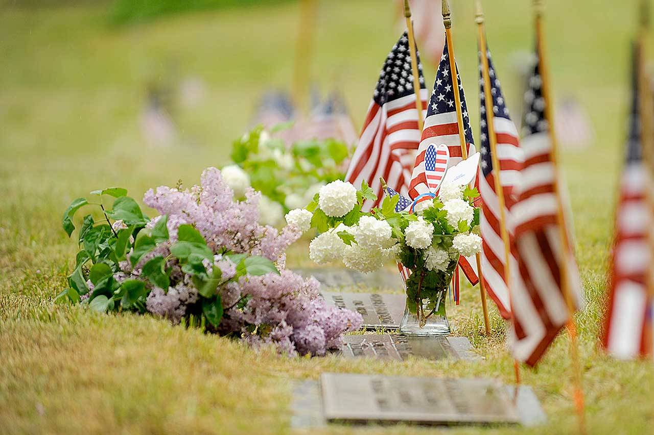 Flags at the Sequim View Cemetery adorn gravesites on Monday. Local veterans groups cancelled Memorial Day ceremonies with a statewide ban on large gatherings in place. (Michael Dashiell/Olympic Peninsula News Group)
