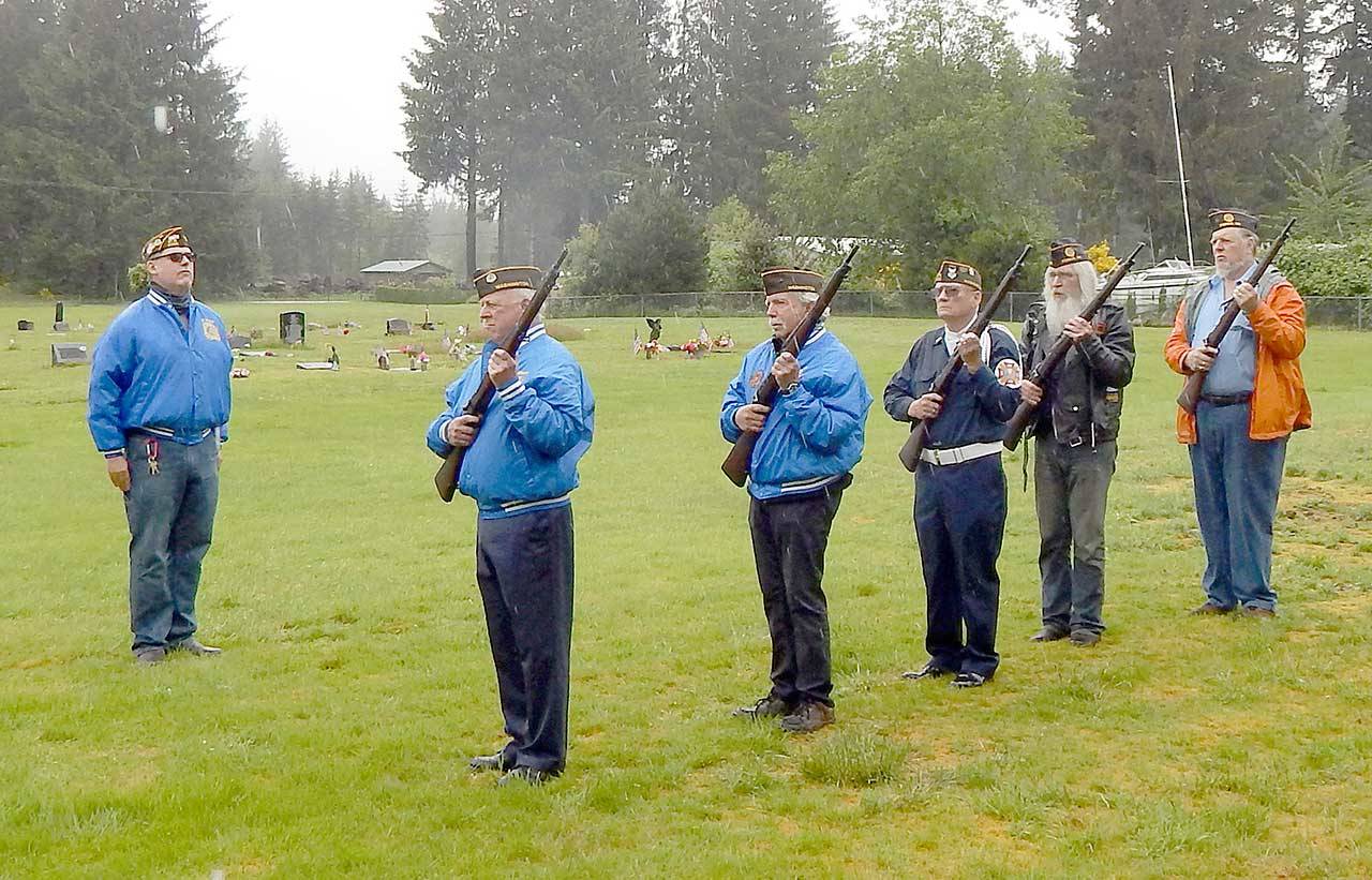 Dave Williams prepares to give the order for the gun salute Monday morning at the Forks Cemetery for the annual Memorial Day Observance. Members of the Forks VFW and American Legion posts made up the squad. They include Mike McCracken, Larry Baysinger, Paul Hampton, Rick Seguin and Joe Wright. VFW Post commander Tom Hughes led the program with words from Auxilliary President Janet Hughes and Forks Mayor Tim Fletcher. Chelsea Biciunas ended the ceremony by playing taps on her trumpet. (Christi Baron/Olympic Peninsula News Group)
