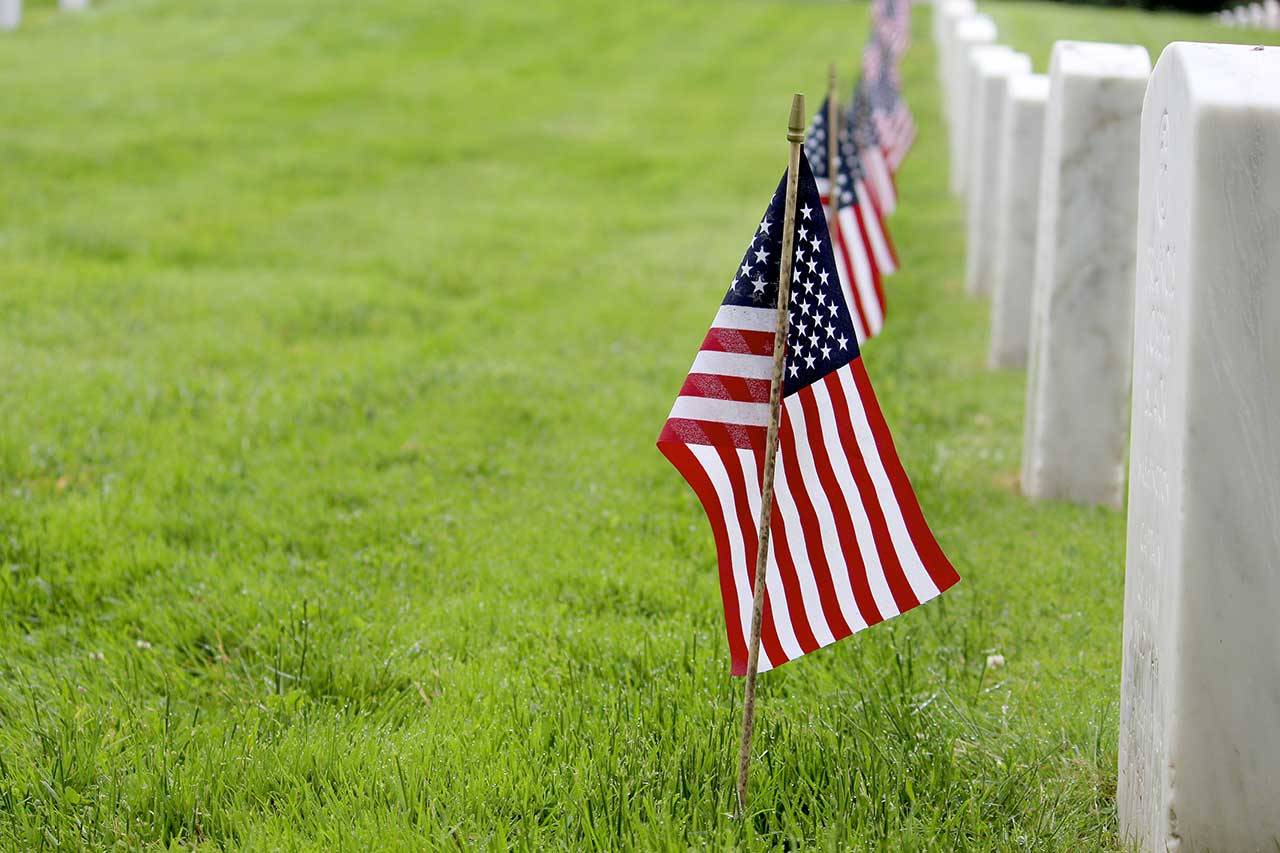 Flags adorn each gravesite at the Fort Worden Military Cemetery on Monday in honor of Memorial Day. (Zach Jablonski/Peninsula Daily News)