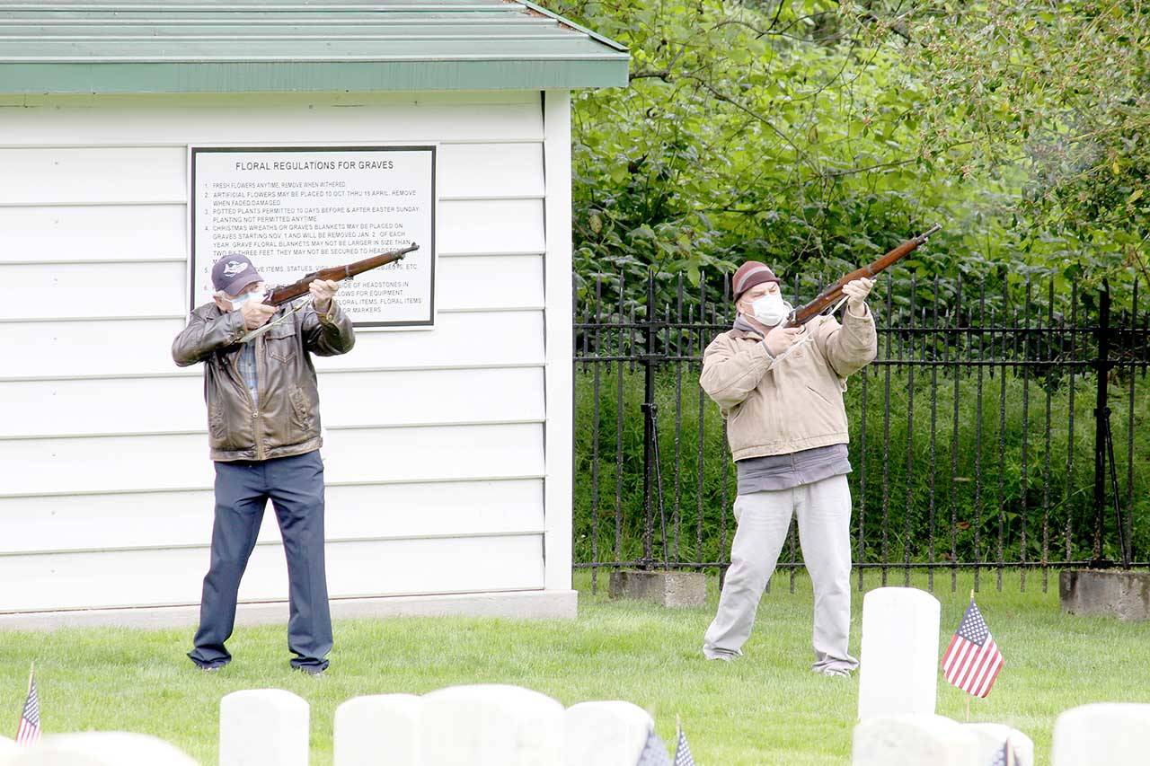 Members of the American Legion Marvin G. Shields Post 26 perform a gun salute in honor of Memorial Day at a joint ceremony Monday put on by the Legion and the Benevolent and Protective Order of Elks Lodge 317 at the Fort Worden Military Cemetery. (Zach Jablonski/Peninsula Daily News)