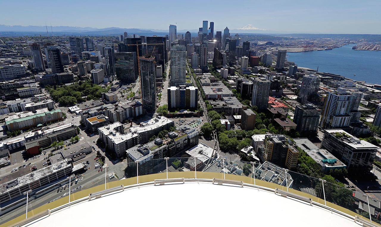 Downtown Seattle and mostly empty streets are shown Wednesday, May 27, 2020, as viewed from the Space Needle. Many workers continue to work from home due to stay-at-home orders intended to prevent the further spread of the coronavirus. (Ted S. Warren/Associated Press)
