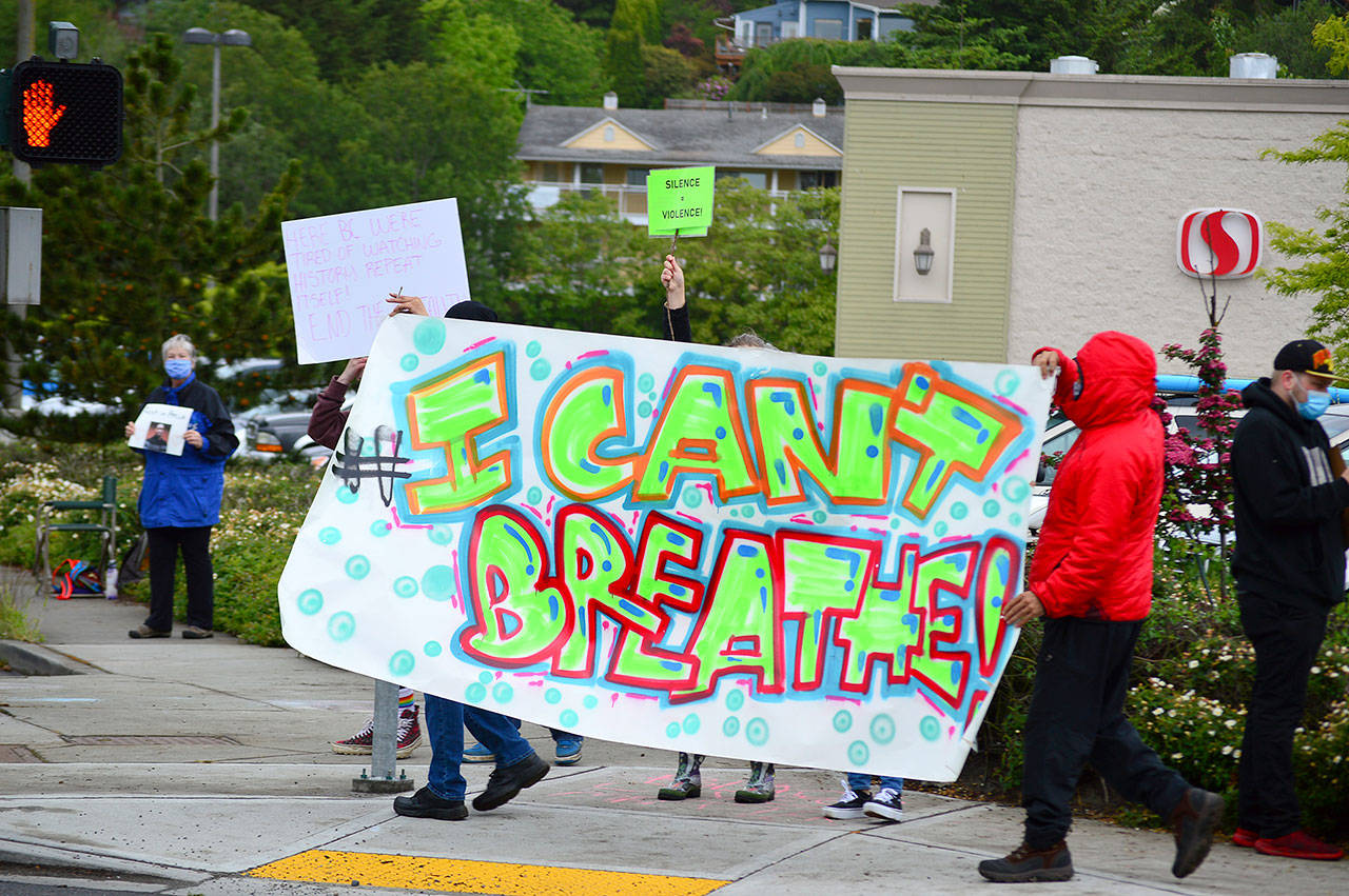 Protesters gather along Sims Way in Port Townsend on Saturday, May 30, 2020. Like other demonstrations across the country, including in Clallam County, participants decried the death of black men including George Floyd of Minneapolis. (Diane Urbani de la Paz/for Peninsula Daily News)