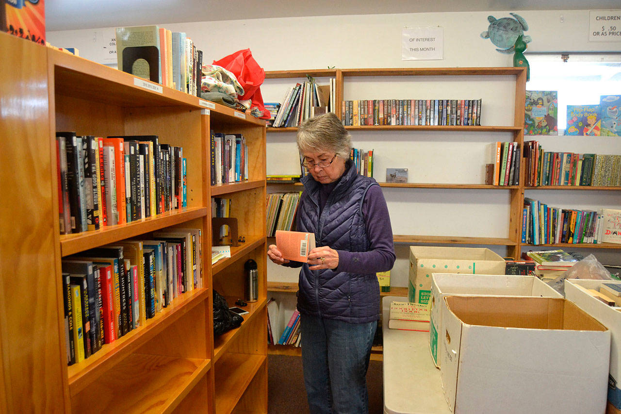 Jean Rucker, a 13-year volunteer with Friends of Sequim Library, prepares materials to sell during the Friends’ book sale earlier this year. NOLS staff are preparing a grant application for state funding to enlarge the Sequim Library facility on North Sequim Avenue. Matthew Nash/Olympic Peninsula News Group
