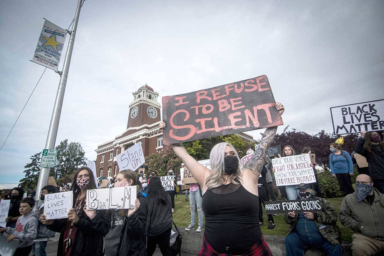 Kimberley Littlejohn holds a sign that says “I refuse to be silent” during the Black Lives Matter protest, attended by an estimated 600 people on Saturday at the Clallam County Courthouse in Port Angeles. (Jesse Major/for Peninsula Daily News)