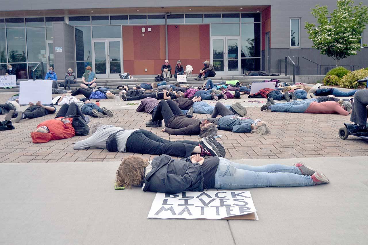 More than 130 people gathered in front of the Sequim Civic Center on Friday for a vigil to grieve black people who have died from police violence. Toward the beginning of the demonstration, many participants laid on the ground for eight minutes and 46 seconds in honor of George Floyd, who died on May 25 in Minneapolis, Minn., after being handcuffed face down. (Matthew Nash/Olympic Peninsula News Group)