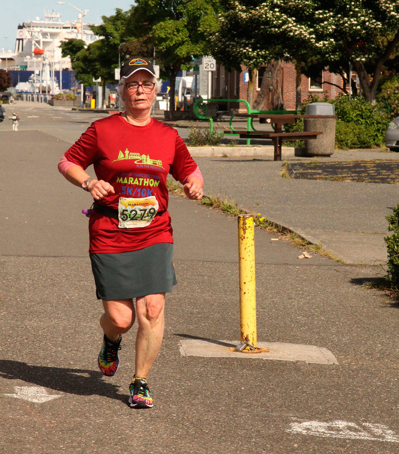 Dave Logan/for Peninsula Daily News Norma Humphreys of Tacoma starts her 5K run at the Port Angeles Pier on Sunday morning as part of the North Olympic Discovery Marathon virtual event.