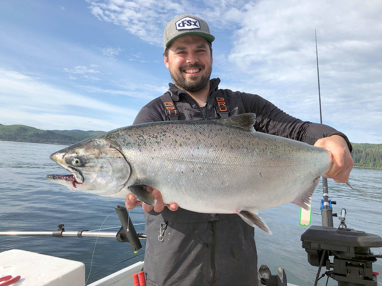 Bellingham angler Tyler Dockins landed this chinook believed to weigh in the upper teens while fishing near Mushroom Rock off Neah Bay with his father Ron Miller and father’s cousin Marty Gray on Tuesday. The trio landed their one-fish king limit all four days they fished in Miller’s boat, The Witchy Woman, including limiting by 6:50 a.m. Wednesday. (Photo courtesy of Marty Gray)