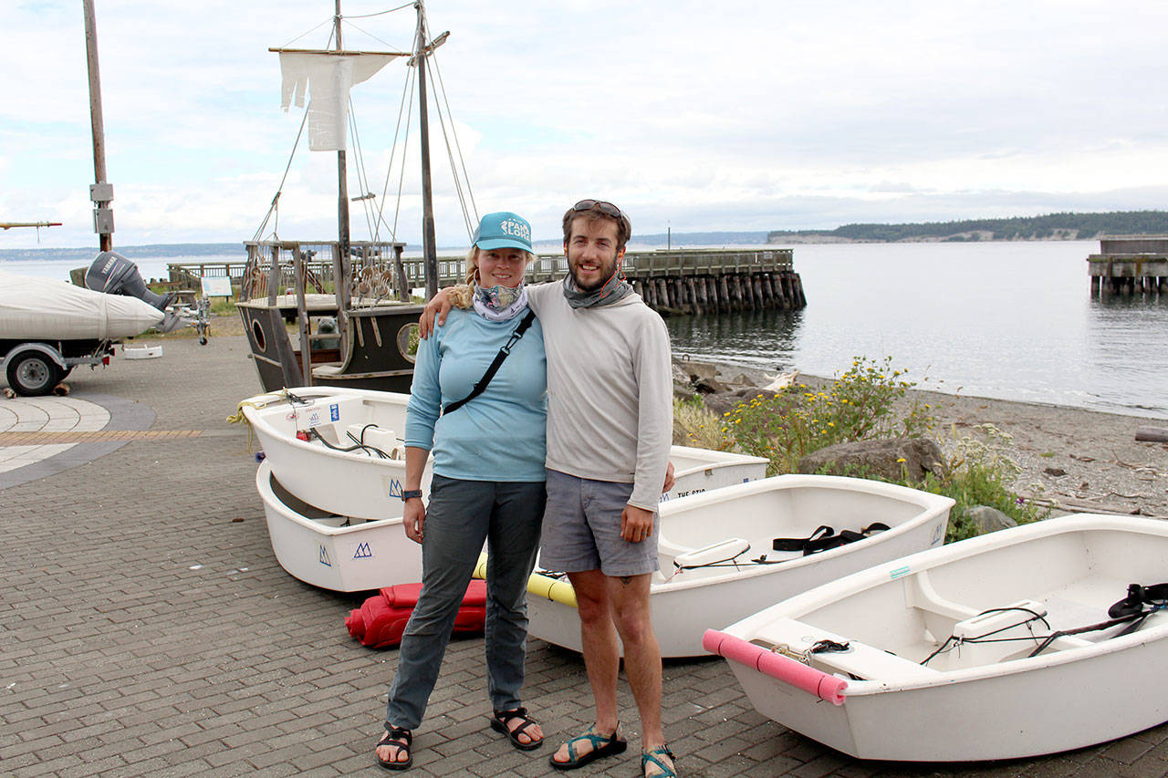 Northwest Maritime Center instructors Alyce Flanagan and Erik Brown stand with Optis sailboats Tuesday, June 30, 2020, that the married couple will be using to teach 10- to 17-year-old sailing students how to operate throughout the summer. (Zach Jablonski/Peninsula Daily News)