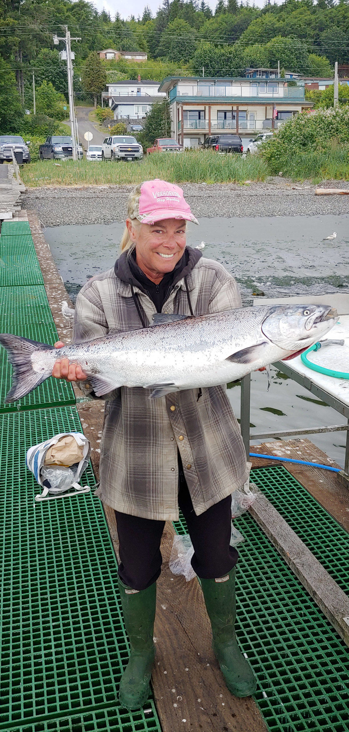 Sekiu’s Kristy King hauled in this 18-pound hatchery chinook while mooching a cut-plug herring off Slip Point on Wednesday, the opening day for recreational salmon season in Marine Areas 5 (Sekiu) and 6 (Port Angeles). (Photo courtesy of Ted King)