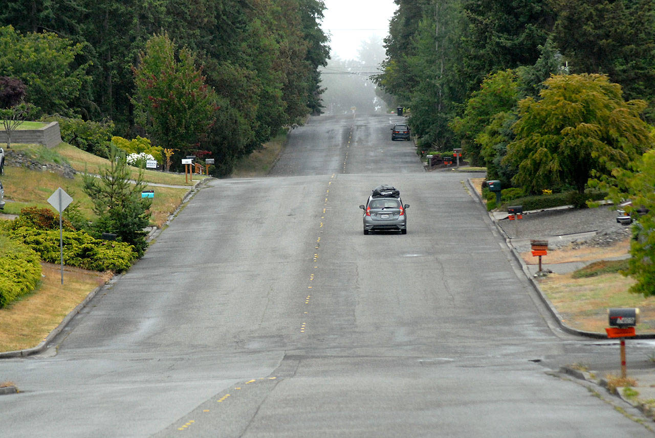 A car makes its way along a sidewalk-less section of South N Street in Port Angeles on Thursday, July 9, 2020. (Keith Thorpe/Peninsula Daily News)