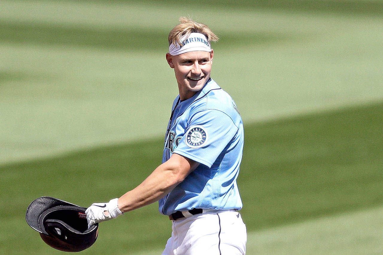 Seattle Mariners’ Jarred Kelenic smiles after hitting a double during a “summer camp” intrasquad baseball game Sunday, July 12, 2020, in Seattle. (AP Photo/Elaine Thompson)