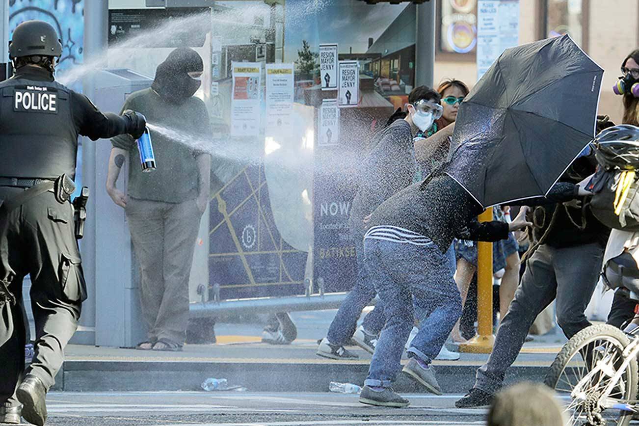 Police declare riot at Seattle protests, make arrests
