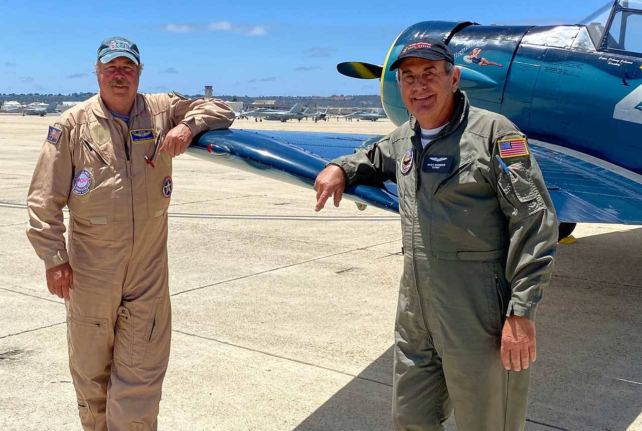 John Johnson and Dave Richardson stand with Richardson’s T-6 Texan airplane in San Diego days before it was loaded aboard the USS Essex for travel to Oahu for commemorations of the end of World War II. (Photo courtesy of Dave Richardson)