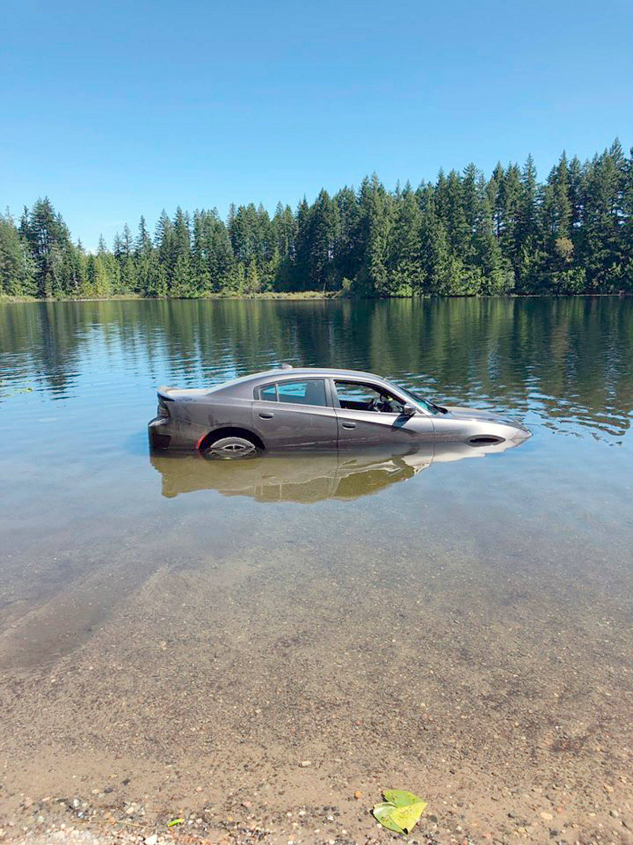 A car was partially submerged in Sandy Shore Lake earlier this week. (Jefferson County Sheriff’s Office)
