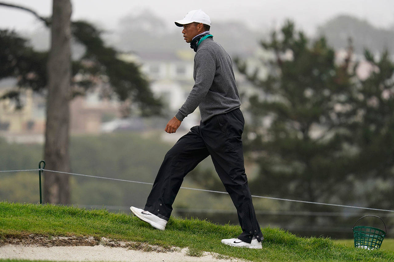 Tiger Woods walks along a green during practice for the PGA Championship golf tournament at TPC Harding Park in San Francisco on Tuesday, Aug. 4, 2020. (Jeff Chiu/Associated Press)