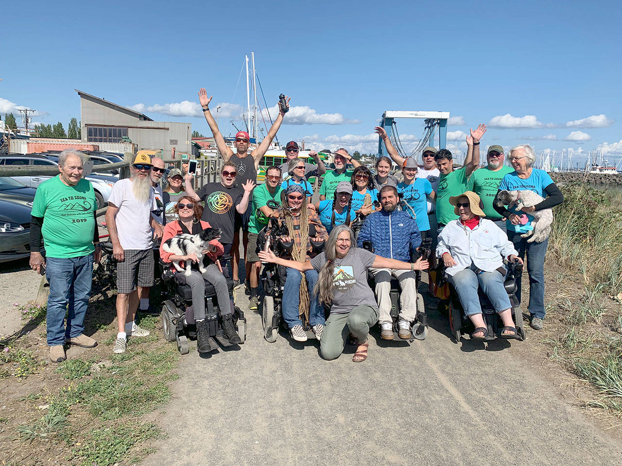 Participants in the first Sea to Sound, a multi-modal ride along the length of the Olympic Discovery Trail, celebrate reaching the end of the Larry Scott Trail in Port Townsend last August. The second annual Sea to Sound will be held Aug. 28-30.