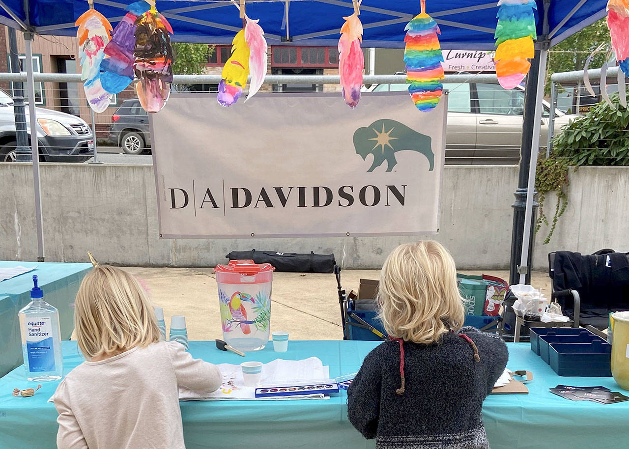 A pair of kids work in watercolors at the July 11 Port Angeles Farmers Market. The Juan de Fuca Foundation will host another community art project at this Saturdays market. (Photo courtesy Juan de Fuca Foundation for the Arts)