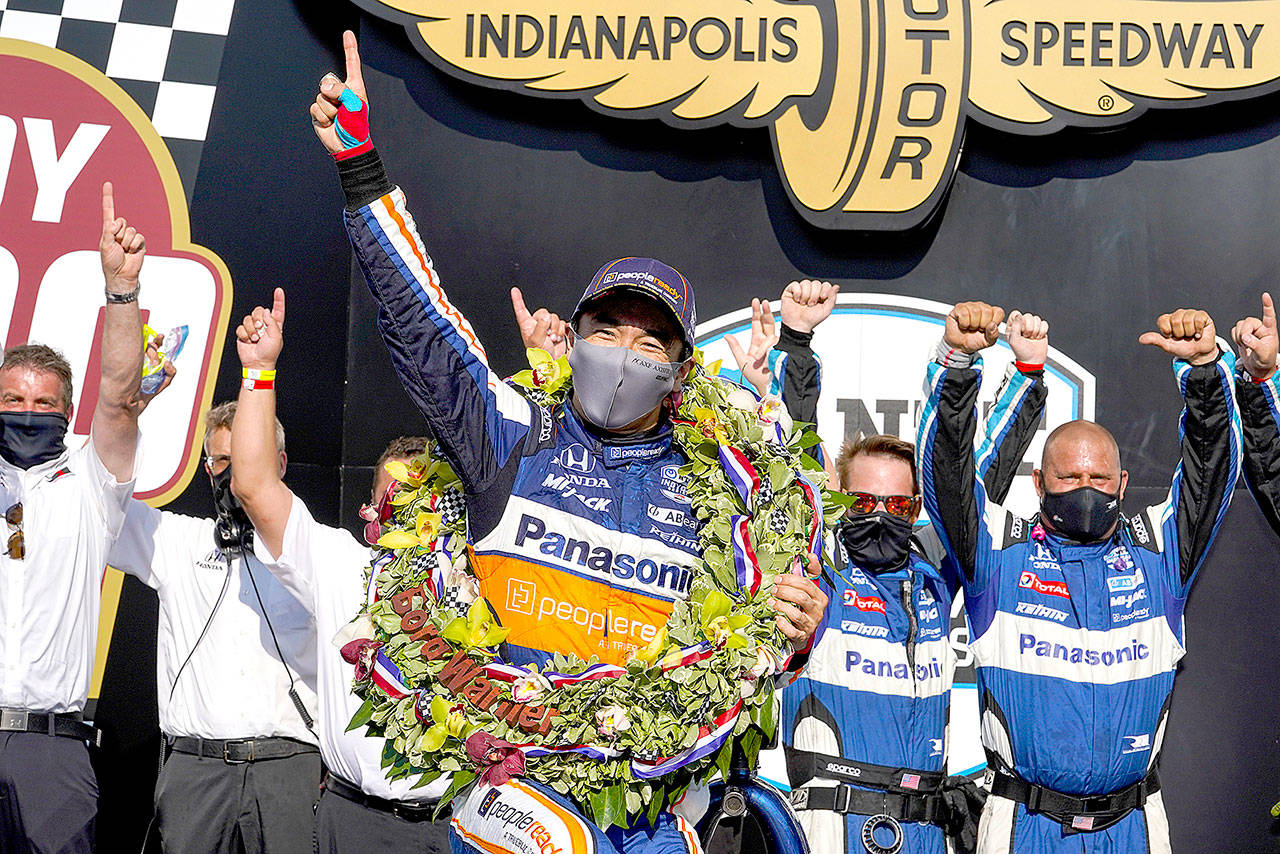 Takuma Sato, of Japan, celebrates after winning the Indianapolis 500 auto race at Indianapolis Motor Speedway in Indianapolis, Sunday, Aug. 23, 2020. (AP Photo/Michael Conroy)
