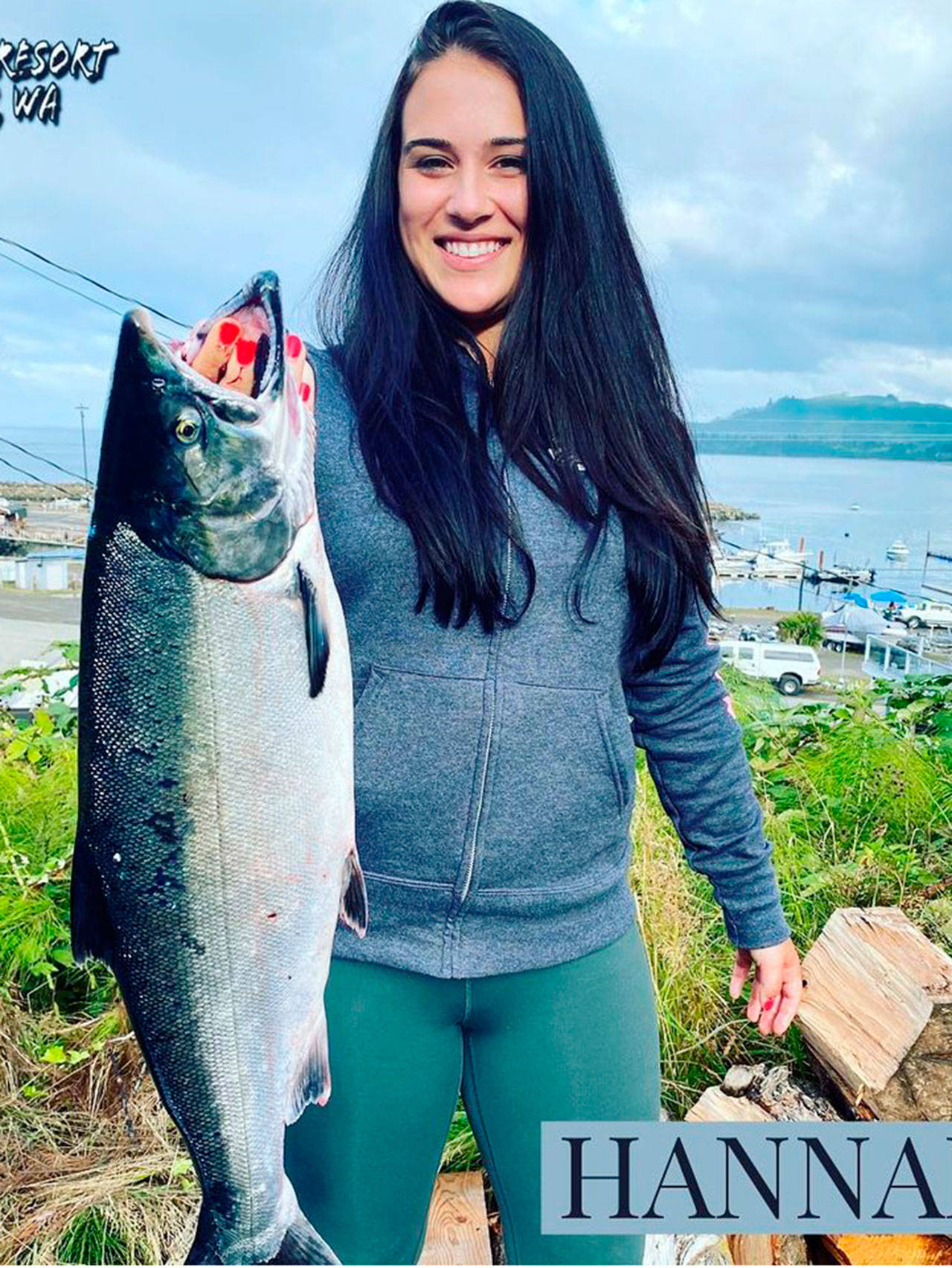 Hanna Cinkovich of Seattle recently caught this good-sized hatchery coho while fishing off Sekiu. (Photo courtesy of Mason’s Resort)