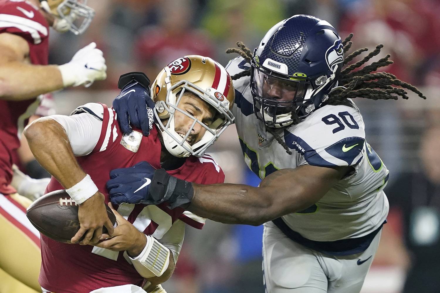 Tony Avelar/The Associated Press San Francisco 49ers quarterback Jimmy Garoppolo, left, avoids being sacked by Seattle Seahawks defensive end Jadeveon Clowney (90) in Santa Clara, Calif., in November 2019. The Tennessee Titans announced Sunday that they had signed Clowney. San Francisco 49ers quarterback Jimmy Garoppolo, left, avoids being sacked by Seattle Seahawks defensive end Jadeveon Clowney (90) in Santa Clara, Calif., in November 2019. The Tennessee Titans announced Sunday that they had signed Clowney. (Tony Avelar/The Associated Press)