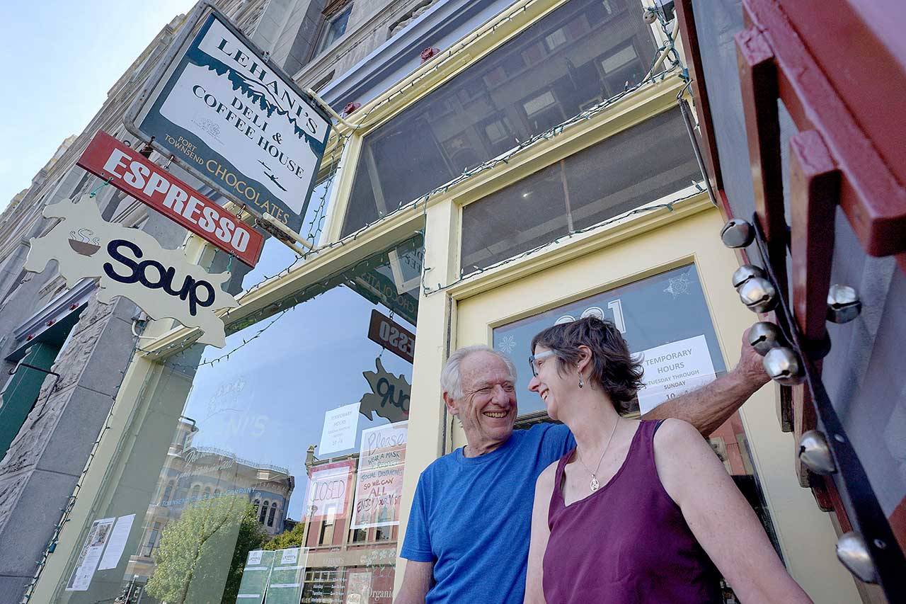 Bill LeMaster, left, and Lynn Hamlin-LeMaster stand in the doorway of Lehani’s Deli and Coffee on Monday in downtown Port Townsend. The couple is selling the cafe they’ve owned and operated for the past 18 years and hopes to find a buyer who is looking for the same kind of lifestyle change they found when they moved to Port Townsend in 2002. (Nicholas Johnson/Peninsula Daily News)