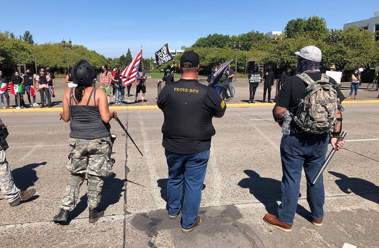 Supporters of President Donald Trump and Black Lives Matter protesters confront each other at the Oregon state Capitol in Salem, Ore. on Monday, Sept. 7, 2020. (Andrew Selsky/Associated Press)