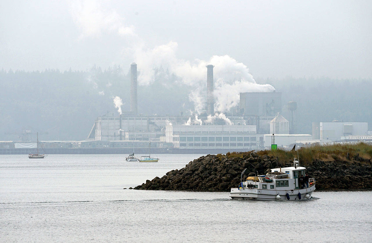 The Port Townsend Paper Mill is visible beyond the entrance to the Port Townsend Boat Haven marina Thursday afternoon for the first time in a week as air quality improved and visibility increased after overnight rainfall. (Nicholas Johnson/Peninsula Daily News)