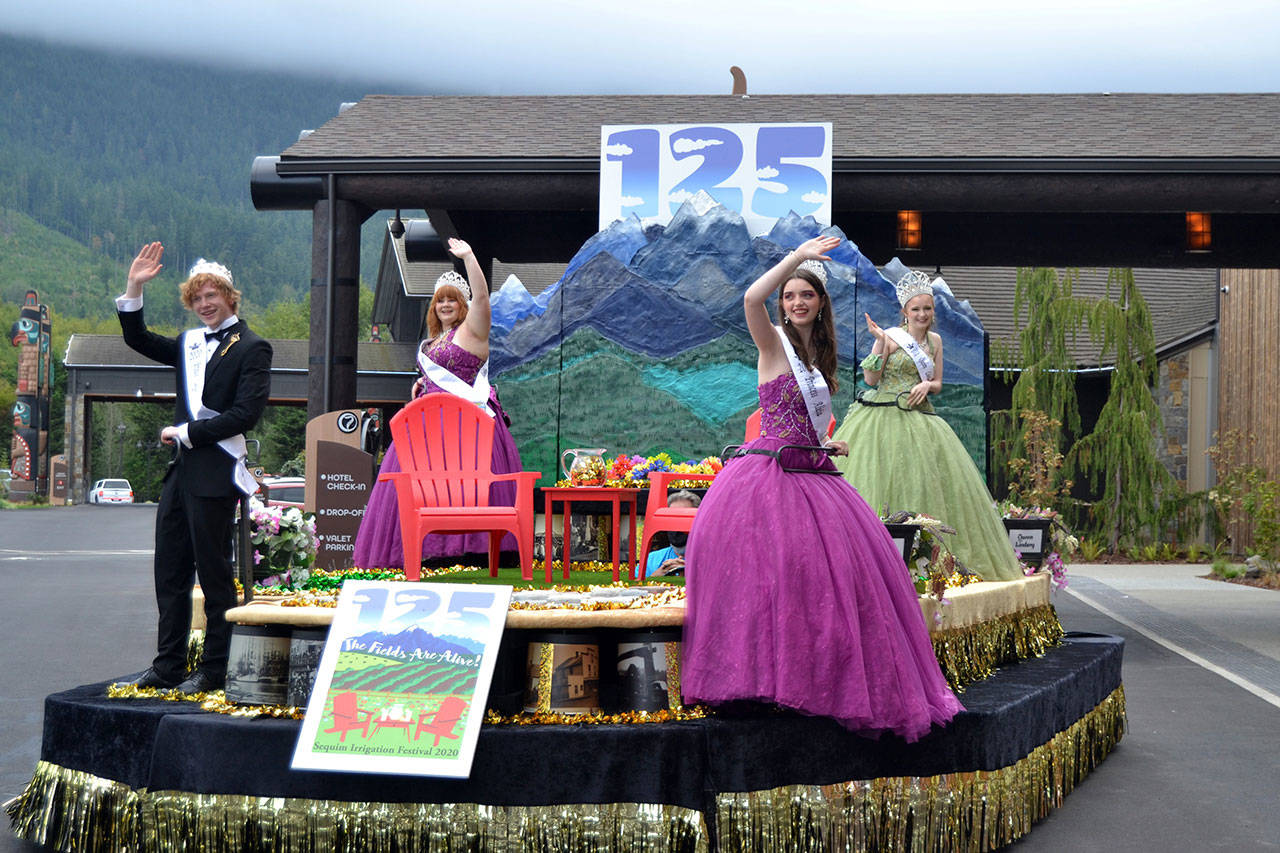 Irrigation Festival Royalty, from left, prince Logan Laxson, princess Brii Hingtgen, princess Alicia Pairadee, and queen Lindsey Coffman wave from their float for the first time Sept. 19, 2020, outside 7 Cedars Casino after COVID-19 concerns led organizers to delay the reveal in March. (Matthew Nash/Olympic Peninsula News Group)