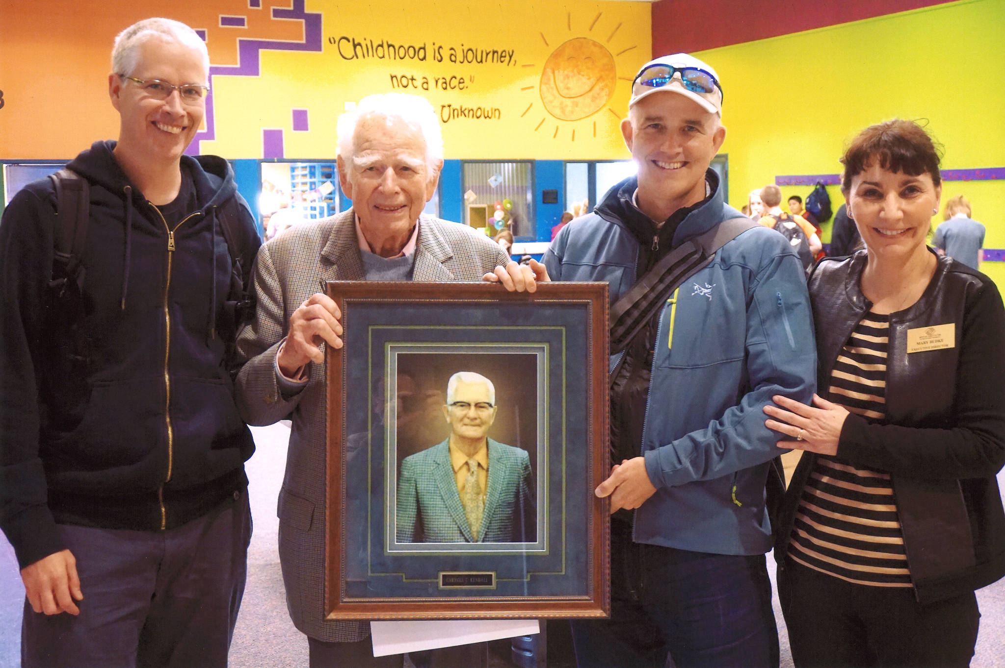 Donald Kendall, second from left, is honored in 2014. His sons Kent, left, and Don Jr., second from right, are joined by Mary Budke, executive director at the Boys & Girls Clubs of the Olympic Peninsula. (Courtesy photo)
