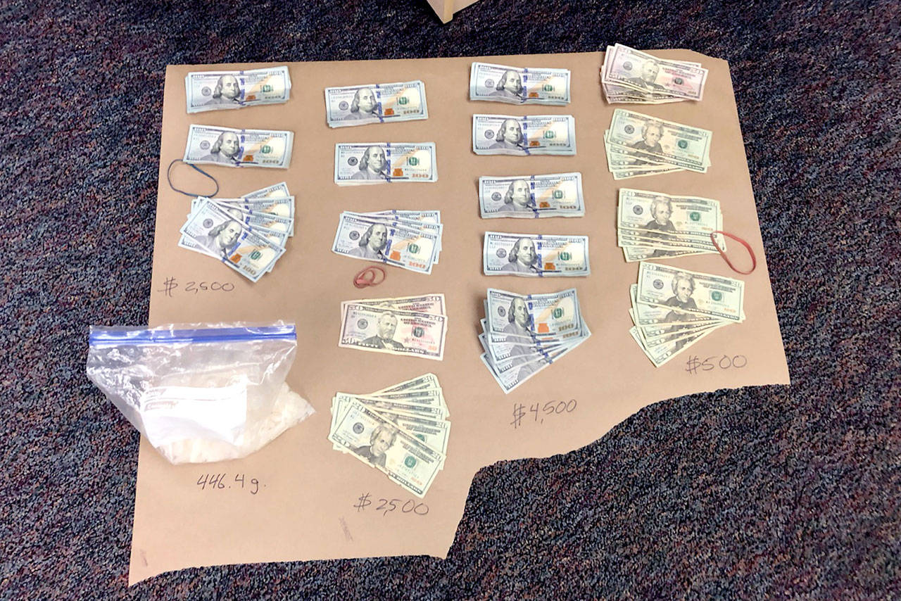 Detectives said they found 463.5 grams (just over 1 pound) of suspected methamphetamine with an approximate street value $18,500; 10.2 grams of suspected heroin with an estimated street value of $1,000; two rifles (one of which had previously been reported stolen); and $14,868 in cash. (Courtesy photo)