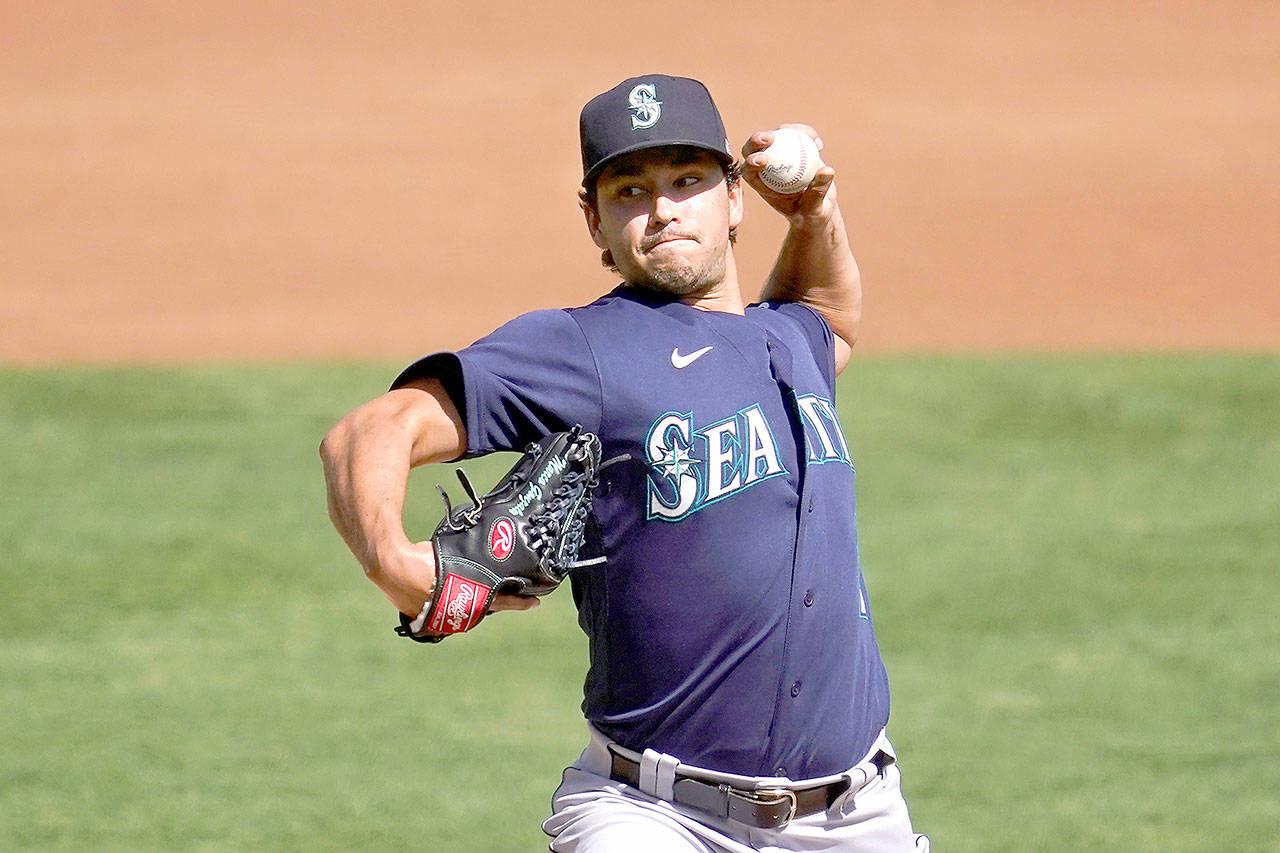 Seattle Mariners’ Marco Gonzales pitches against the Oakland Athletics on Sunday. (Jeff Chiu/Associated Press)