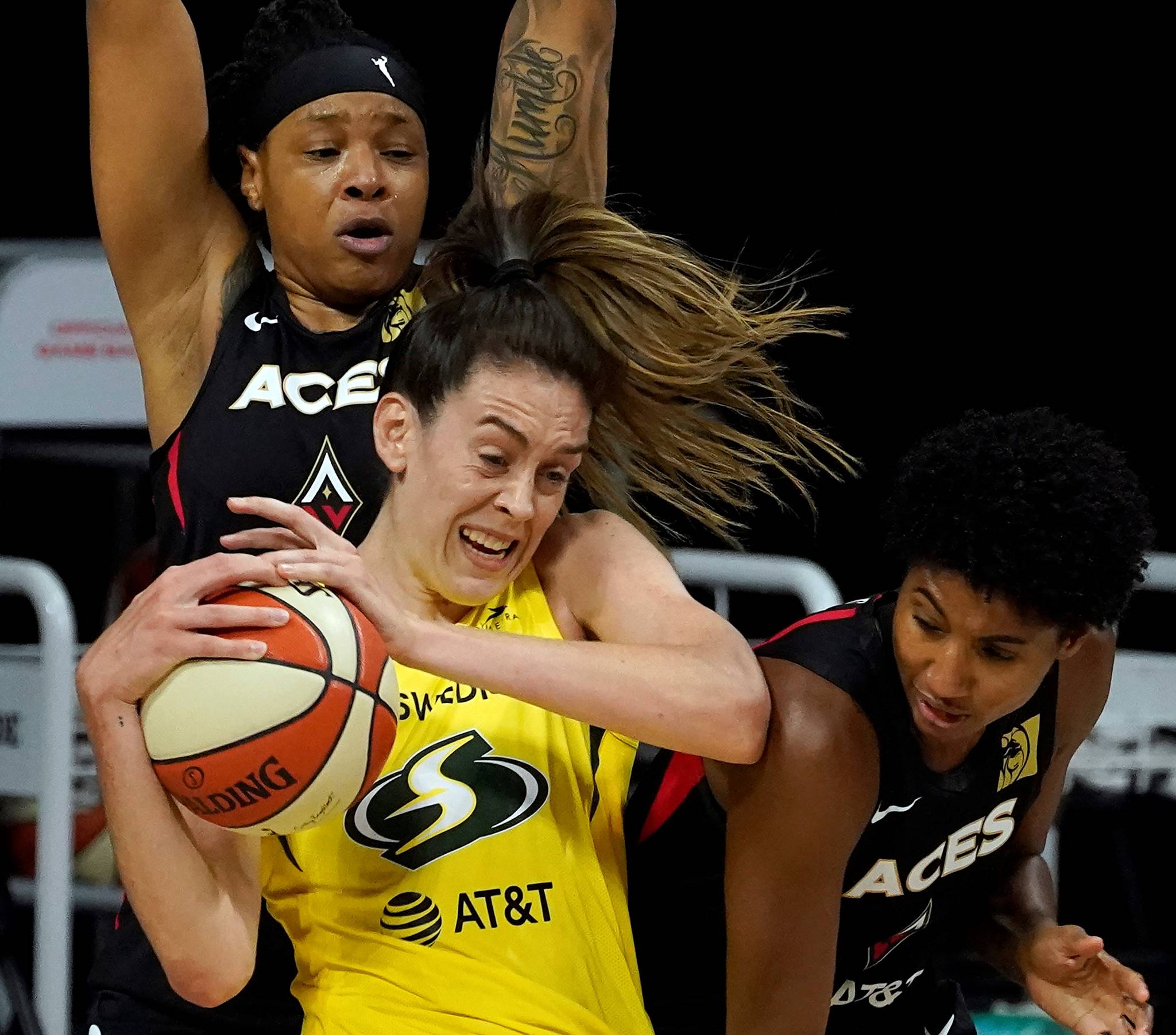 Seattle Storm forward Breanna Stewart (30) battles with Las Vegas Aces forward Angel McCoughtry (35) and forward Emma Cannon (32) for the ball during the first half of Game 1 of basketball’s WNBA Finals Friday in Bradenton, Fla. (AP Photo/Chris O’Meara)