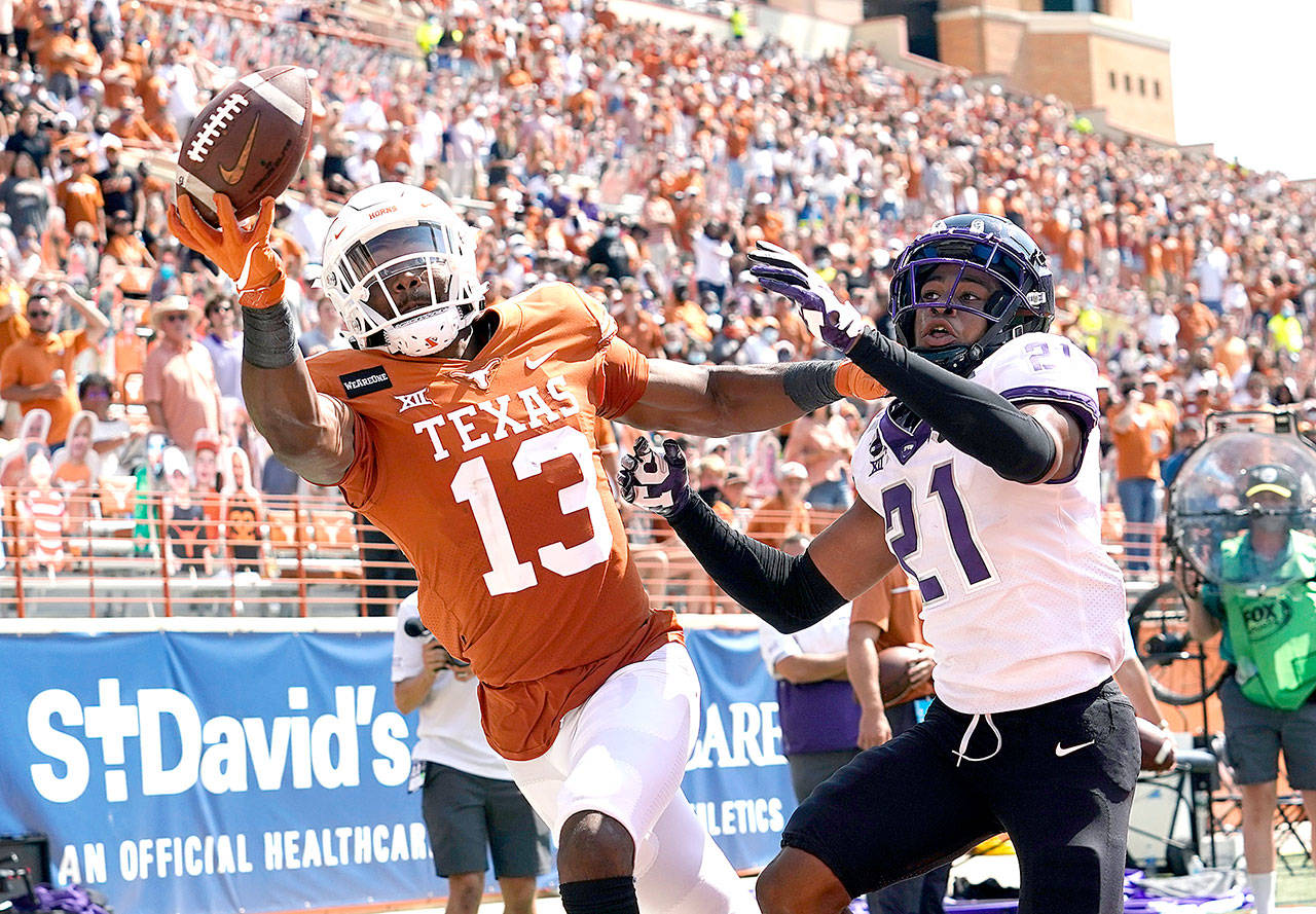 TCU cornerback Noah Daniels (21) breaks up a pass intended for Texas wide receiver Brennan Eagles (13) on Saturday in Austin, Texas. (Eric Gay/The Associated Press)