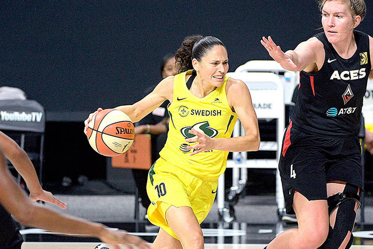 Seattle Storm guard Sue Bird (10) drives to the basket in front of Las Vegas Aces center Carolyn Swords (4) during the second half of Game 2 of basketball's WNBA Finals, Sunday, Oct. 4, 2020, in Bradenton, Fla. (AP Photo/Phelan M. Ebenhack)