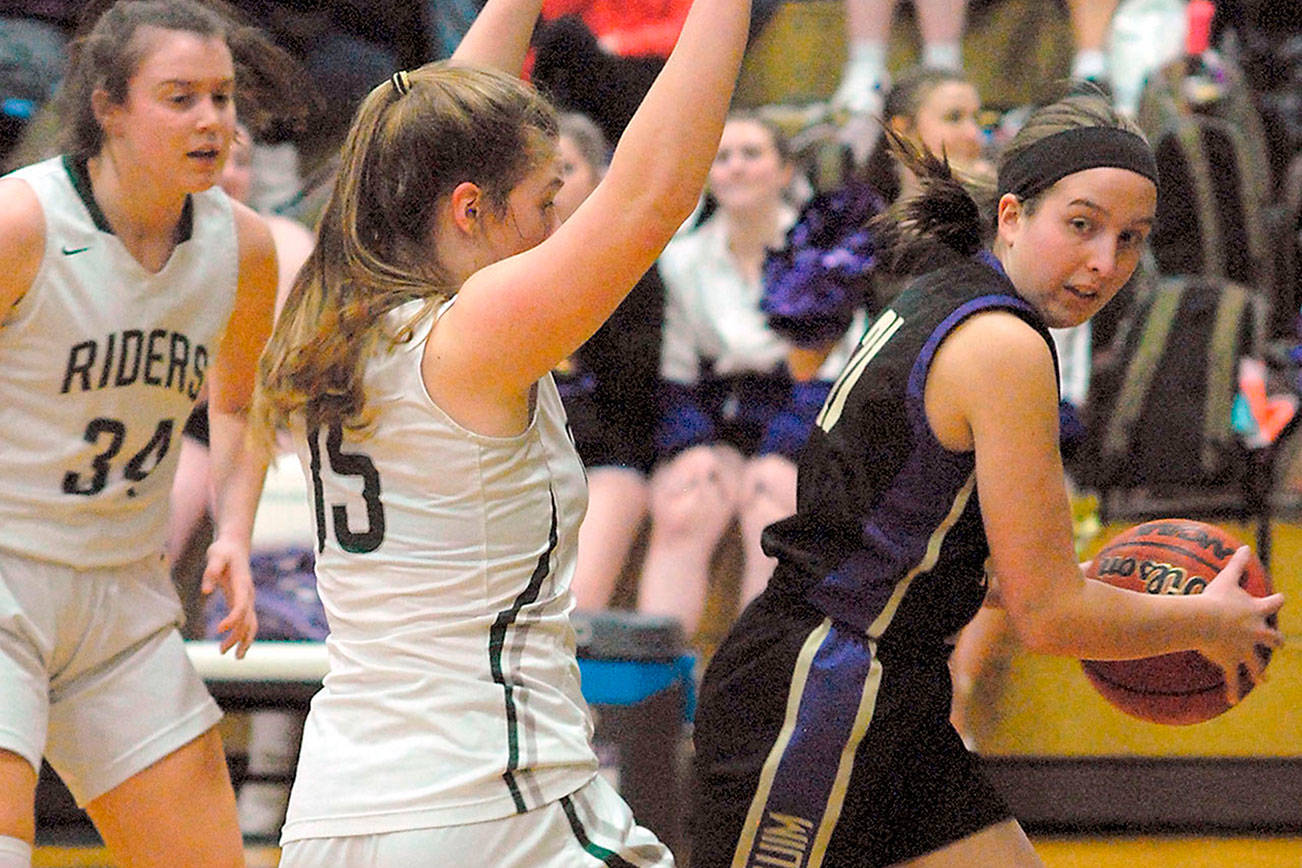 Keith Thorpe/Peninsula Daily NewsSequim's Kalli Wiker, right, gets trapped at the line by Port Angeles' Myra Walker as Walker's teammate Jaida Wood, left, looks on during Thursday's game in Port Angeles.