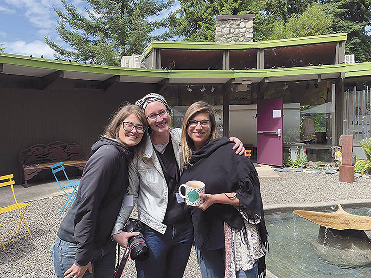The Port Angeles Fine Arts Center staff is pictured at the 2019 Summertide Festival. From left are Lauren Bailey, community outreach coordinator; Sarah Jane, gallery and program director; and Jessica Elliott, executive director. (Courtesy photo)
