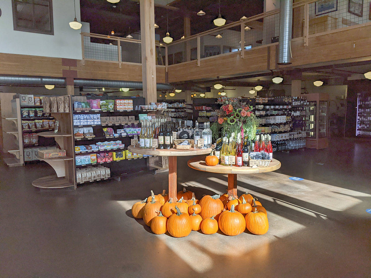 The first thing people see walking into Aldrich’s Market now is a wine and vodka display that is a collaboration between Aldrich’s, Port Townsend Vineyard and Admiralty Distillers to celebrate the 125-year-old history of Aldrich’s Market. (Zach Jablonski/Peninsula Daily News)