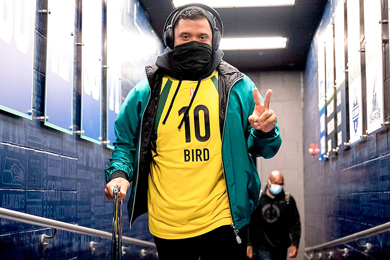 A photo Russell Wilson posted on his Twitter account of him wearing a Sue Bird jersey Sunday night before his game against the Vikings.