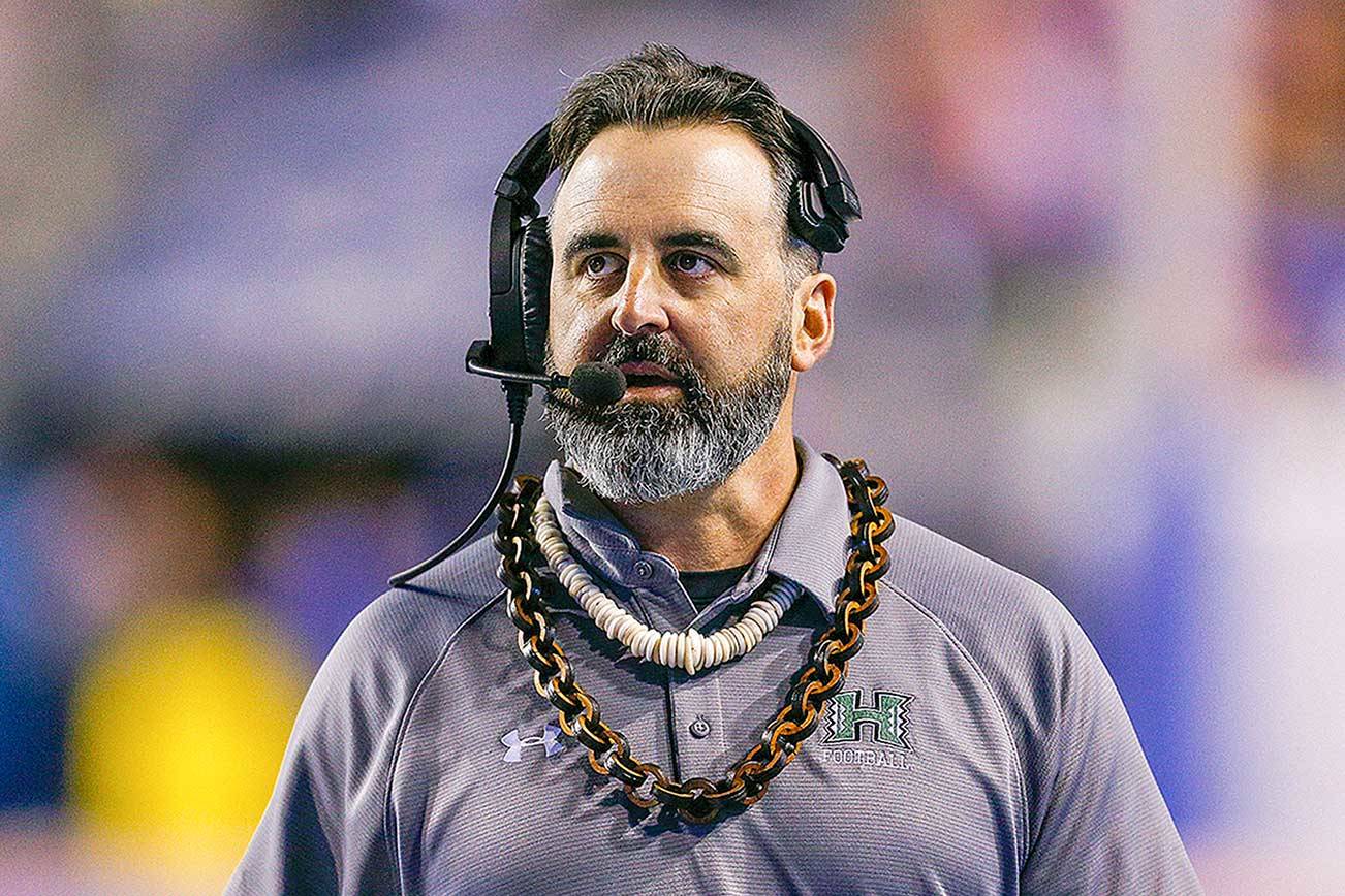 FILE - In this Saturday, Oct. 12, 2019, file photo, Hawaii head coach Nick Rolovich walks the sideline during the second half of an NCAA college football game against Boise State, in Boise, Idaho. Nick Rolovich dived right in when Washington State hired him in January. Just when it seemed like things were up and rolling, the COVID-19 pandemic hit. The national shutdown hurt coaches across college football as they prepare for the 2020-21 season, but it was particularly difficult on programs with first-year coaches trying to build something new from the ground up. (AP Photo/Steve Conner, File)