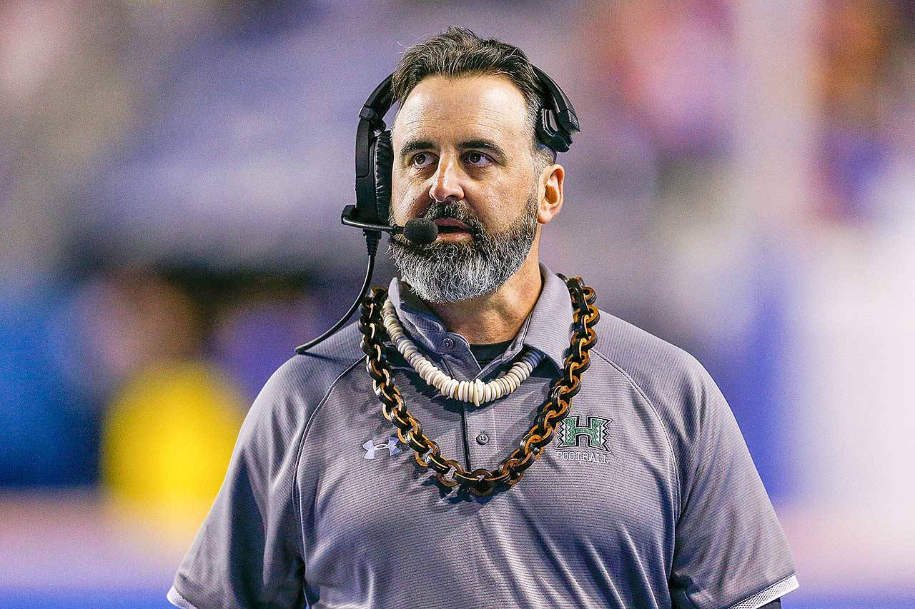 In this Saturday, Oct. 12, 2019, file photo, Hawaii head coach Nick Rolovich walks the sideline during the second half of an NCAA college football game against Boise State in Boise, Idaho. Nick Rolovich dived right in when Washington State hired him in January. Just when it seemed like things were up and rolling, the COVID-19 pandemic hit. The national shutdown hurt coaches across college football as they prepare for the 2020-21 season, but it was particularly difficult on programs with first-year coaches trying to build something new from the ground up. (Steve Conner/Associated Press file)
