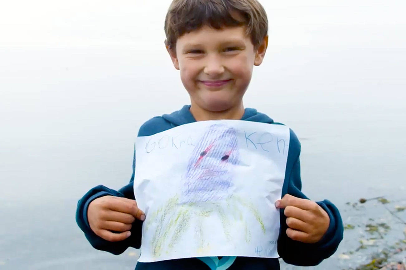 Jefferson County first-grader Henry Norris shows off his winning drawing in Gov. Jay Inslee's contest to find and draw a kraken in the Salish Sea. Inslee announced the contest the day the new Seattle NHL hockey franchise introducted its Kraken nickname.  Seattle Kraken