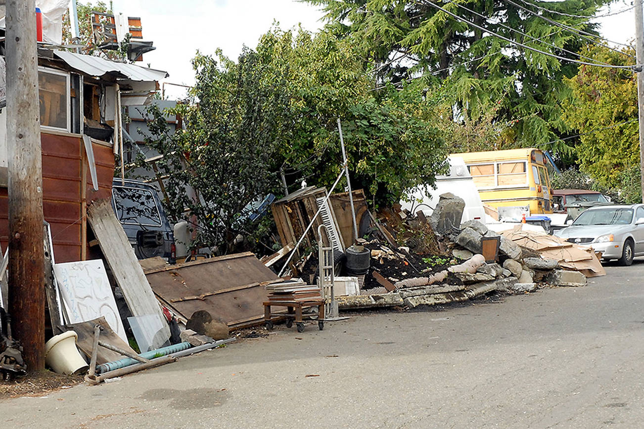 Keith Thorpe/Peninsula Daily NewsTrash and debris lines an alley behind the 100 block of East Fifth Street behind the Lincoln Street Safeway store in Port Angeles on Friday.