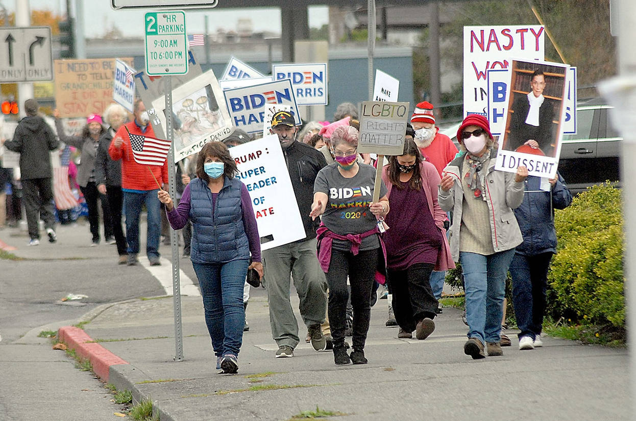 Keith Thorpe/Peninsula Daily NewsMarchers celebrating the legacy of the late Supreme Court Justice Ruth Bader Ginsberg make their way up Lincoln Street to the Clallam County Courthouse after a procession through downtown Port Angeles on Saturday. A crowd of nearly 300 people took part in the demonstration, which also served as a protest of the policies of President Donald Trump..
