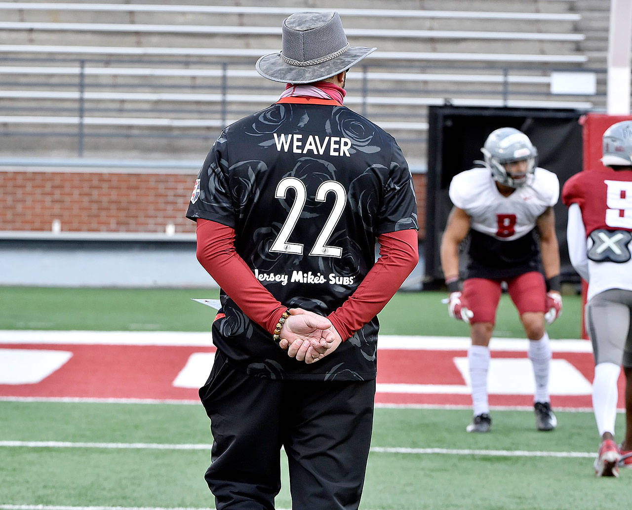 Washington State football coach Nick Rolovich wearing the jersey of Portland Thorns forward and former Cougars’ women’s soccer standout Morgan Weaver during a scrimmage Saturday. (Photo courtesy of Washington State University Athletics)