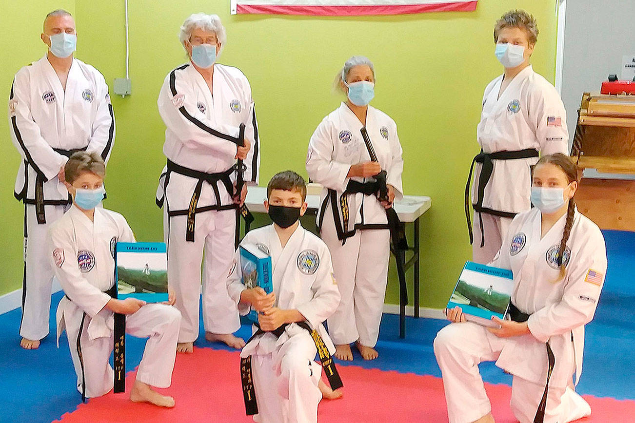 Six students from the Bodystrong Taekwon-do Academy in Sequim recently tested for their black belts in Clackamas, Ore., earlier this month. From left, back row are Master Brandon Stoppani, students Craig Fahrenholtz, Linda Allen and Adrian Golbeck. From left front row are students Aron Golbeck, Hunter Muckley and Jessica Golbeck.