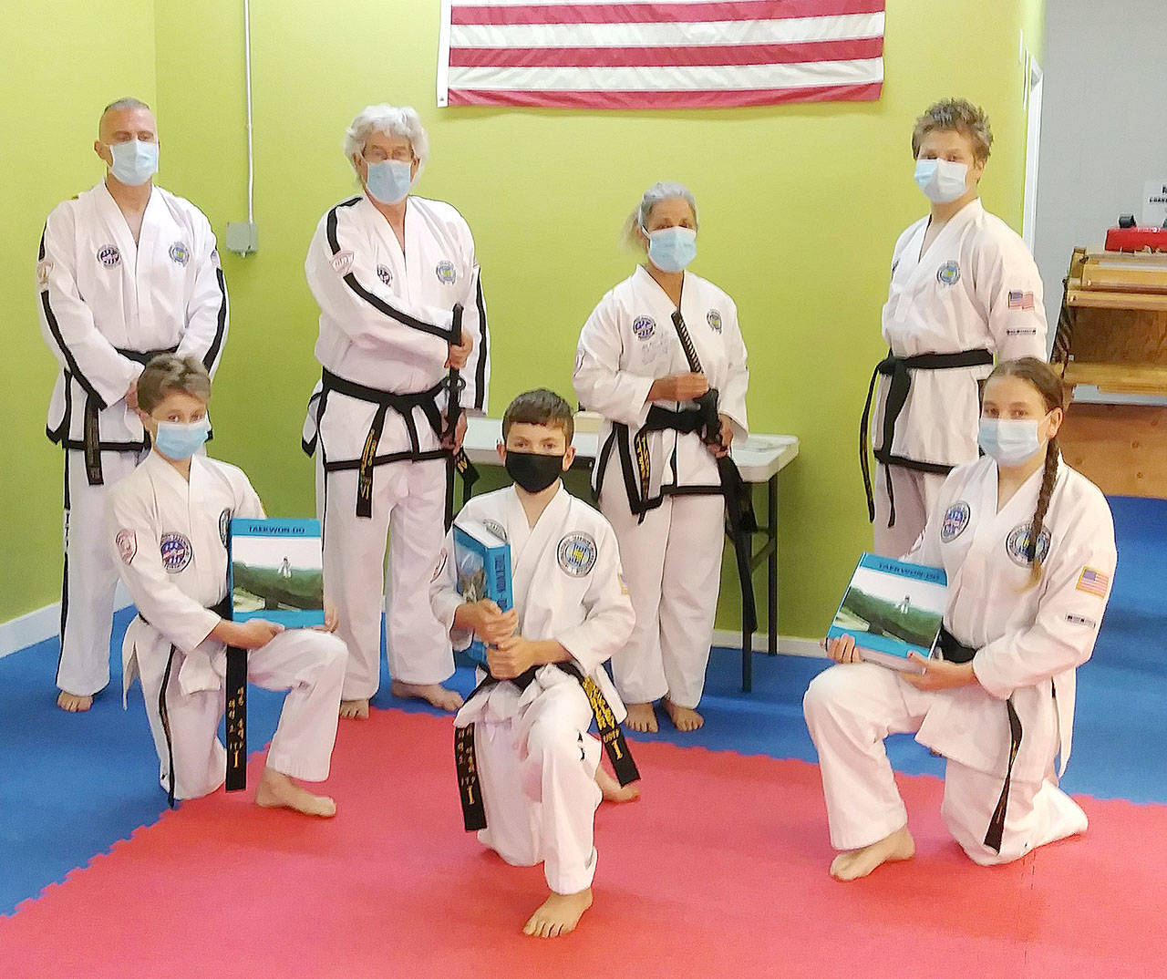 Six students from the Bodystrong Taekwon-do Academy in Sequim recently tested for their black belts in Clackamas, Ore., earlier this month. From left, back row, are Master Brandon Stoppani and students Craig Fahrenholtz, Linda Allen and Adrian Golbeck. From left, front row, are students Aron Golbeck, Hunter Muckley and Jessica Golbeck.